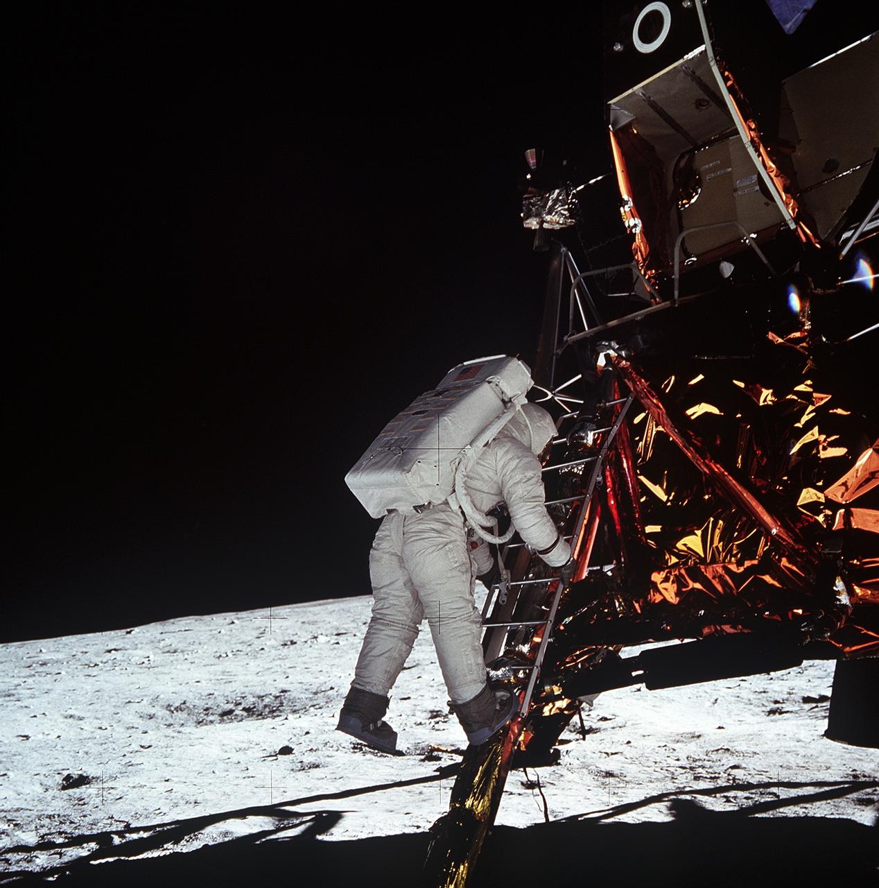 Aldrin descending the Lunar Module ladder